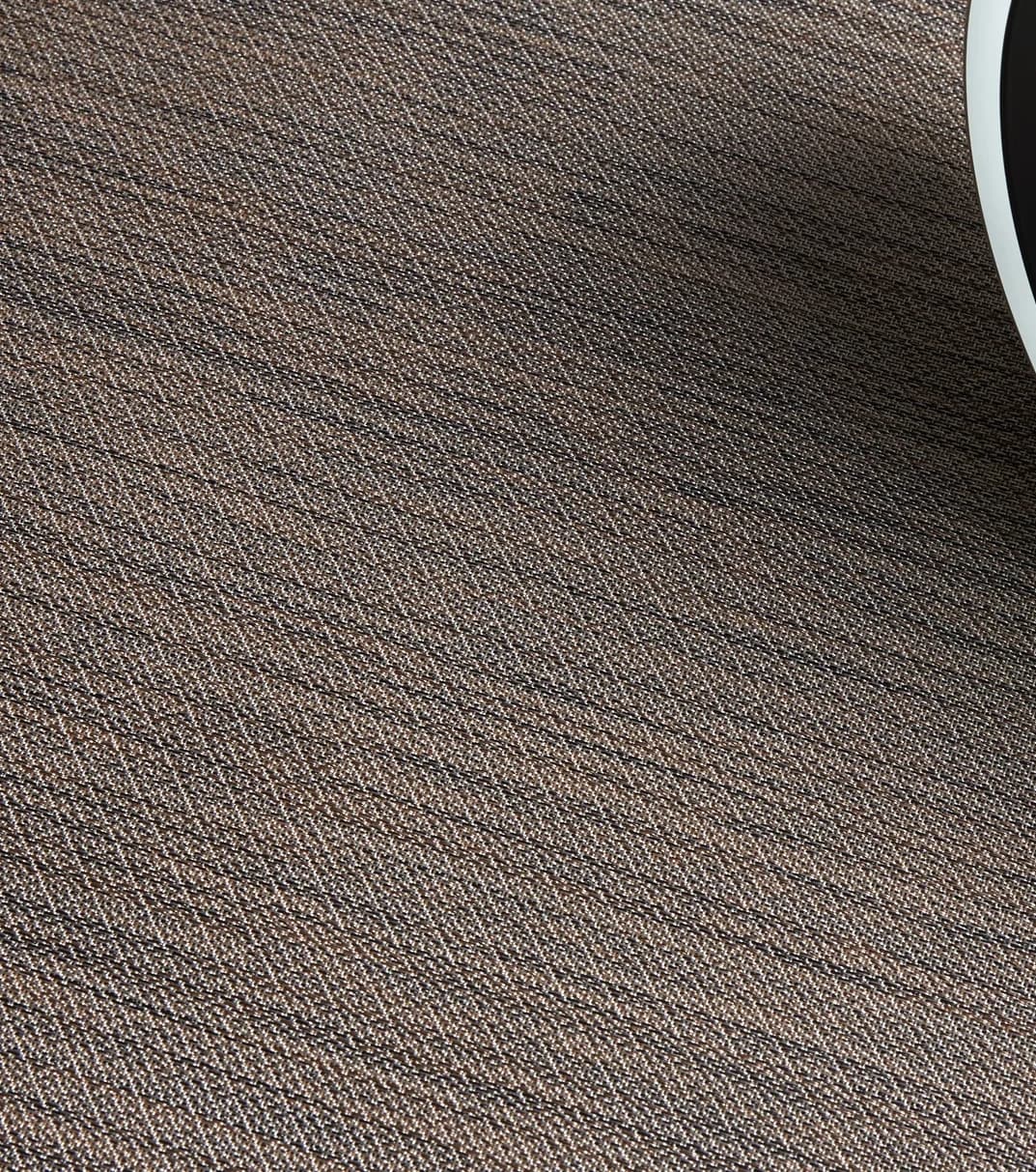 Detail of a woven vinyl surface in an interior setting